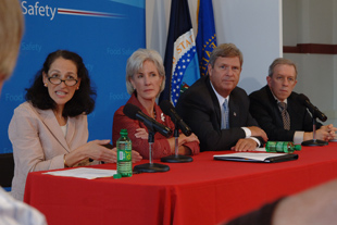 Dr Margaret Hamburg, Kathleen Sebelius, Tom Vilsack, Jerold R. Mande seated at a table with microphones.