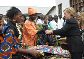 Date: 08/11/2009 Description: Secretary of State Hillary Rodham Clinton purchases a shirt at the Heal Africa clinic in Goma, Congo. © AP Image