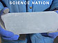 Hands holding partial ice core and the words Science Nation