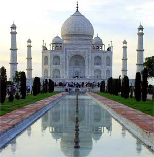 The Taj Mahal is reflected in a pool in Agra, India, June 25, 2003. [© AP Images]