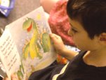 Image of a boy reading.