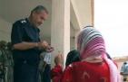 Iraqi police distribute aid, message of hope