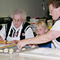 Photo of two women and a girl making kolaches