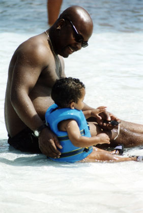 father and son on beach