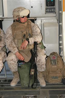 Maj. Charles Clark, commanding officer of Company E, 2nd Battalion, 25th Marine Regiment, Regimental Combat Team 5, waits to depart on a C-17 flight from Kuwait en route to Iraq on Sept. 7.  Company E is headquartered in Harrisburg, Pa., and will be deployed throughout western al-Anbar province, Iraq, with the rest of 2nd Bn., 25th Marines.

