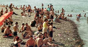 Vacationers on the Black Sea shore in Batumi, Georgia, July 17, 2001. [© AP Images]