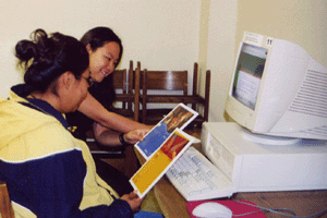 Figure 4: Leslie Hsu interviewing a student at Diné College Library.