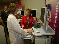 Secretary Gassman (right) views a demo in La Crosse