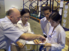 Photo of workers taking samples of ARVs in Vietnam.