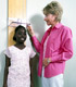 Girl being measured by a medical professional