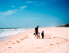 Beachcombing with the kids on a deserted beach. 