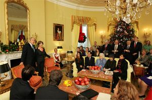 Date: 12/18/2008 Location: Washington, DC Description: President George W. Bush and Mrs. Laura Bush stand in the Yellow Oval Room in the Private Residence of the White House Thursday, Dec. 18, 2008, after the President dropped in on a coffee in honor of the U.S. Afghan Women