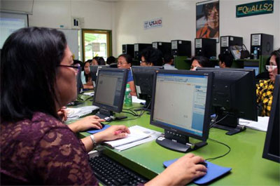 Teachers from Salug, Zamboanga del Norte work on grading spreadsheets during a training session on Microsoft Excel. They appreciated the faster way of keeping track of their students’ performance in class.