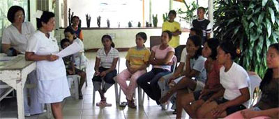 Chief Nurse, Mrs. Helen Gagaa, engages relatives of patients in a focus group discussion to establish better facility standards for the hospital.