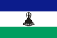 Flag of Lesotho is three horizontal stripes of blue - top - white, and green in proportions 3:4:3; centered in white stripe is a black Basotho hat.