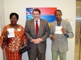 Ambassador Eastham and two visa recipients