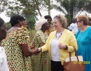 Ambassador Garvey greets members of the community who will benefit from the cassava processing center