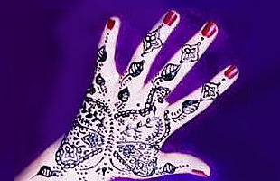 Picture of hand decorated with black henna
