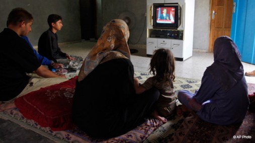 Palestinians watch President Obama's speech on television, Gaza Strip, June 4, 2009. [AP Photo]
