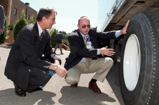 ORNL’s Dana Christensen and Gary Capps inspect one of the H.T. Hackney trucks participating with Knoxville Transit Authority buses in an ORNL study.