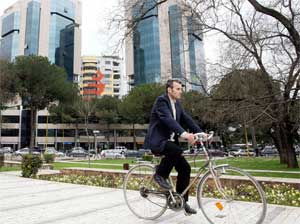 Man bicycles in the Albanian capital of Tirana, April 4, 2007. [© AP Images]