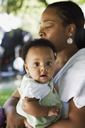 A mother holding a child