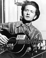 [Woody Guthrie, half-length portrait, facing front, playing guitar]