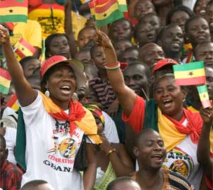 People wave flags during celebration marking Ghana's 50 years of independence at the Independence Square in Accra, Ghana, March 6, 2007. [© AP Images]