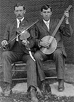 John and Henry Reed, posing with their instruments