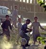 Date: 07/19/2002 Description: Afghan children play soccer on a dusty street in Kabul, Afghanistan, Friday, July 19, 2002. © AP Image