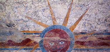 Unusual fresco of a sun with face showing a mustache and goatee, on the ceiling of Mission Concepción's Library