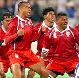 Tongan players perform traditional ritual dance before rugby match in Canberra, Australia, October 15, 2003. [© AP Images]
