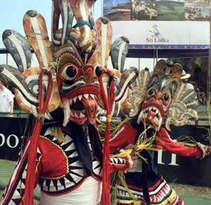 Traditional mask dancers participate in cultural pageant, Kandy, Sri Lanka, March 10, 2001. [© AP Images]