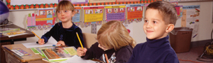 Kunsberg children at their desks