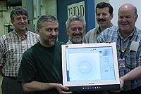 GM/CA CAT staff display the first diffraction image created at the beamline.