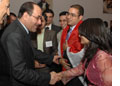 Iraqi Prime Minister Nouri al-Maliki greets students at AED