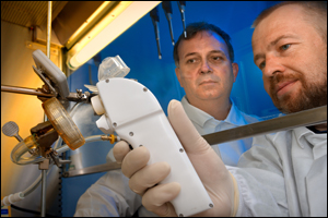 Mark Papania, medical epidemiologist, National Center for Immunization and Respiratory Diseases, works on a vaccine delivery system.