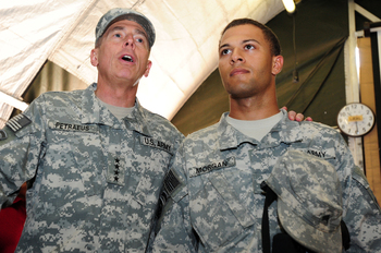 Gen. David Petraeus, U.S. Central Command commander, stands with a fellow Soldier at the Transit Center at Manas. Petraeus thanked military warriors at Manas, and transiting through, for their continued contribution to Operating Enduring Freedom.