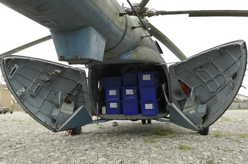 An Afghan MI-17 is loaded to capacity with election ballots for its next delivery. During a two-day period, pilots delivered ballots, polling kits, tables and chairs to remote Afghan locations in support of the Aug. 20 elections.