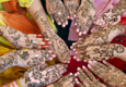 Decorated hands in a circle (AP Image)