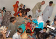 Swabi, June 17’09 - U.S. Ambassador Anne W. Patterson delivers school supplies for more than 500 displaced children during her visit to the Anbar Elementary College Camp in Swabi District, where approximately 2,500 displaced persons are currently residing