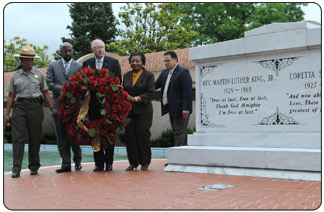 Secretary Salazar lays a wreath at the gravesite of Dr. Martin Luther King Jr. and his wife Coretta Scott King.  He is accompanied by left to right; Martin Luther King, Jr. National Historic Site Superintendent Judy Forte; Ebenezer Baptist Church Pastor Reverend Raphael Warnock; Secretary Salazar; Mrs. Christine King Farris (sister of Dr. Martin Luther King, Jr.); and National Park Service Southeast Regional Director David Vela. [Photo Credit: Tami A. Heilemann DOI]