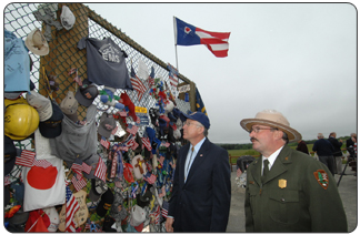 Secretary Salazar with Park Ranger Keith Newlin visits the citizen-created memorial at the site where United- Flight 93 crashed on September 11, 2001.    
(Photo credit: Tami A. Heilemann - DOI)