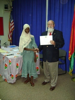D. Andresen giving a student her certificate
