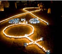 A man in Guatemala lights one of many candles commemorating International Day for the Elimination of Violence against Women in 2008.