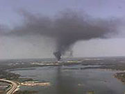 smoke plume from a refinery