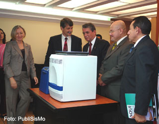 Ambassador McFarland and Health Minister and CDC Director, examine donated equipment.