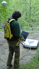  [Photo: Graduate student conducting GPS and radar survey.] 