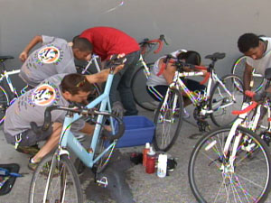 photo: youths working on bicycles