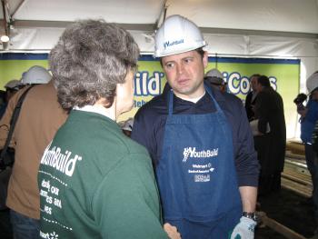 Speaking with other volunteers at a YouthBuild project